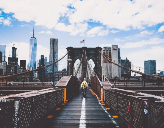 Man Walking on Bridge