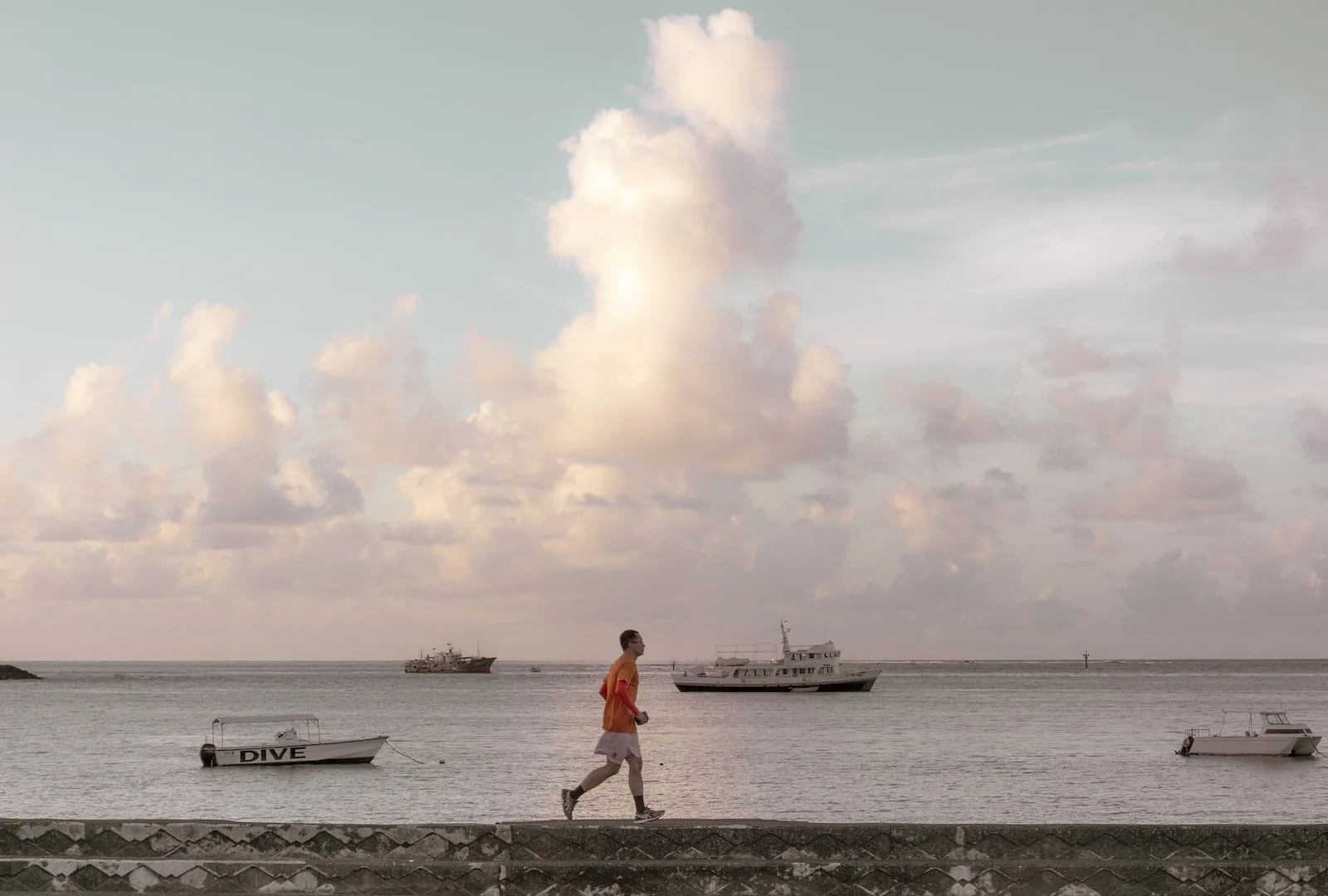 man walking on bay