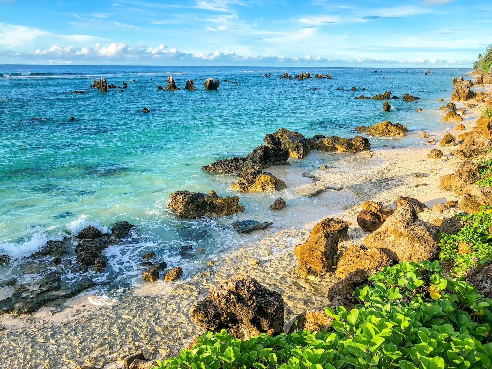 Photo by Winston Chen sea water and rocks by the beach coast during daylight