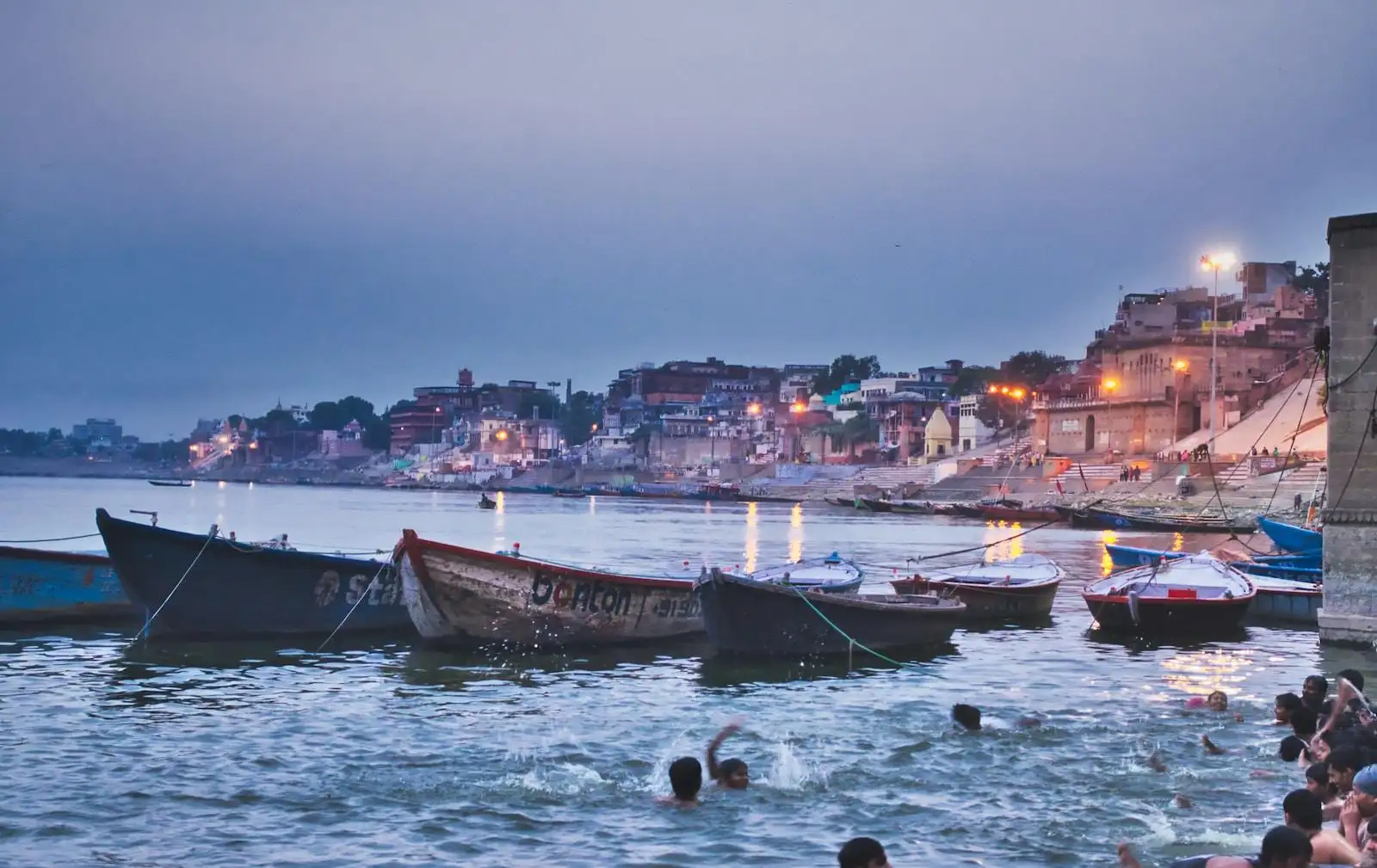 india rowing boats near dock