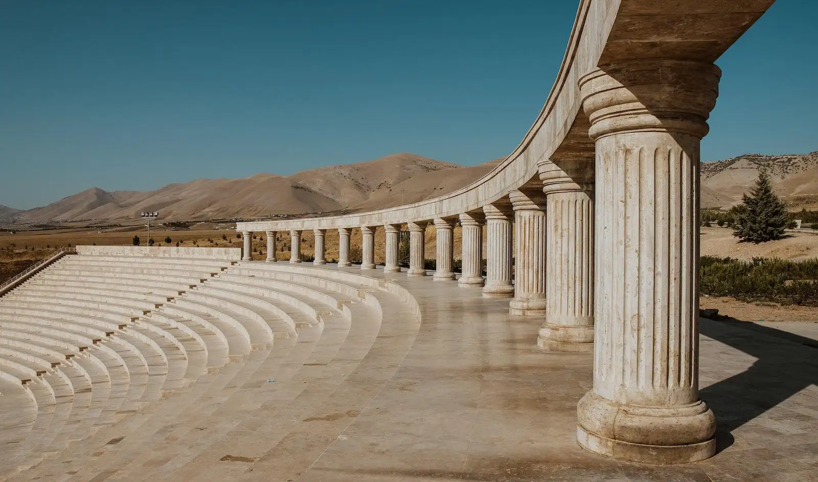 Photo by Bilal Izaddin Brown Concrete Pillars Under Blue Sky
