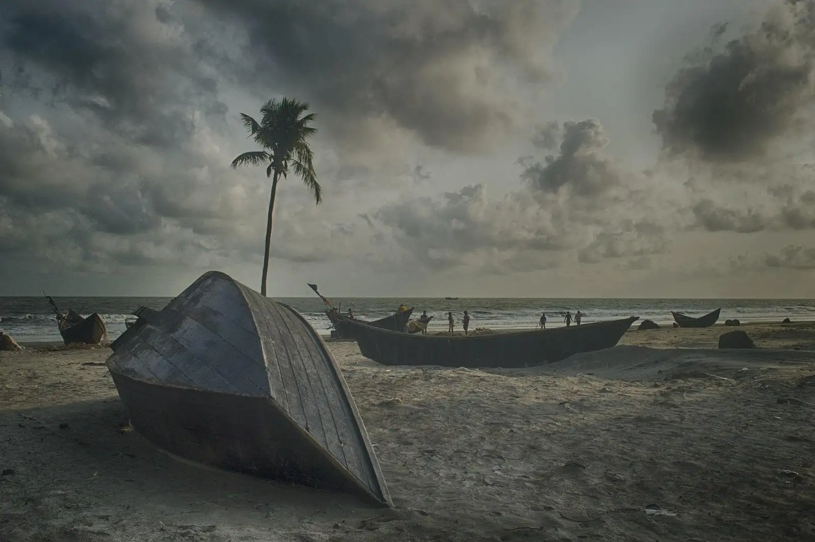 Gray Boat on Gray Sand Beach Under Gray Cloudy Sky