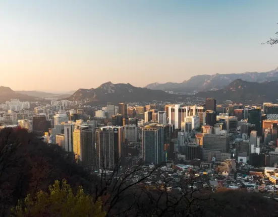 Urban Area Surrounded By Mountain Range