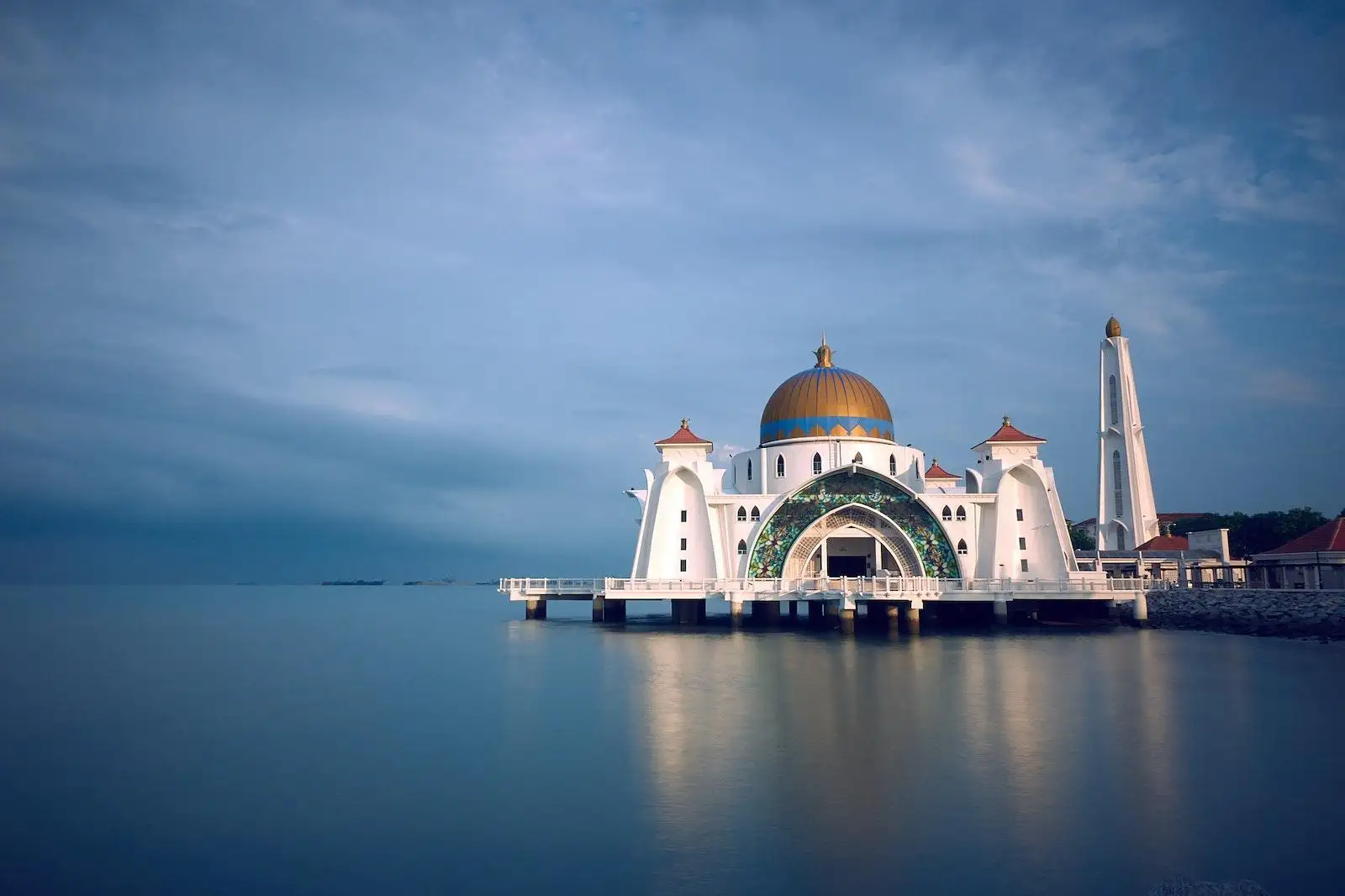 Photo by Indra Gunawan White and Brown Mosque Beside Body of Water