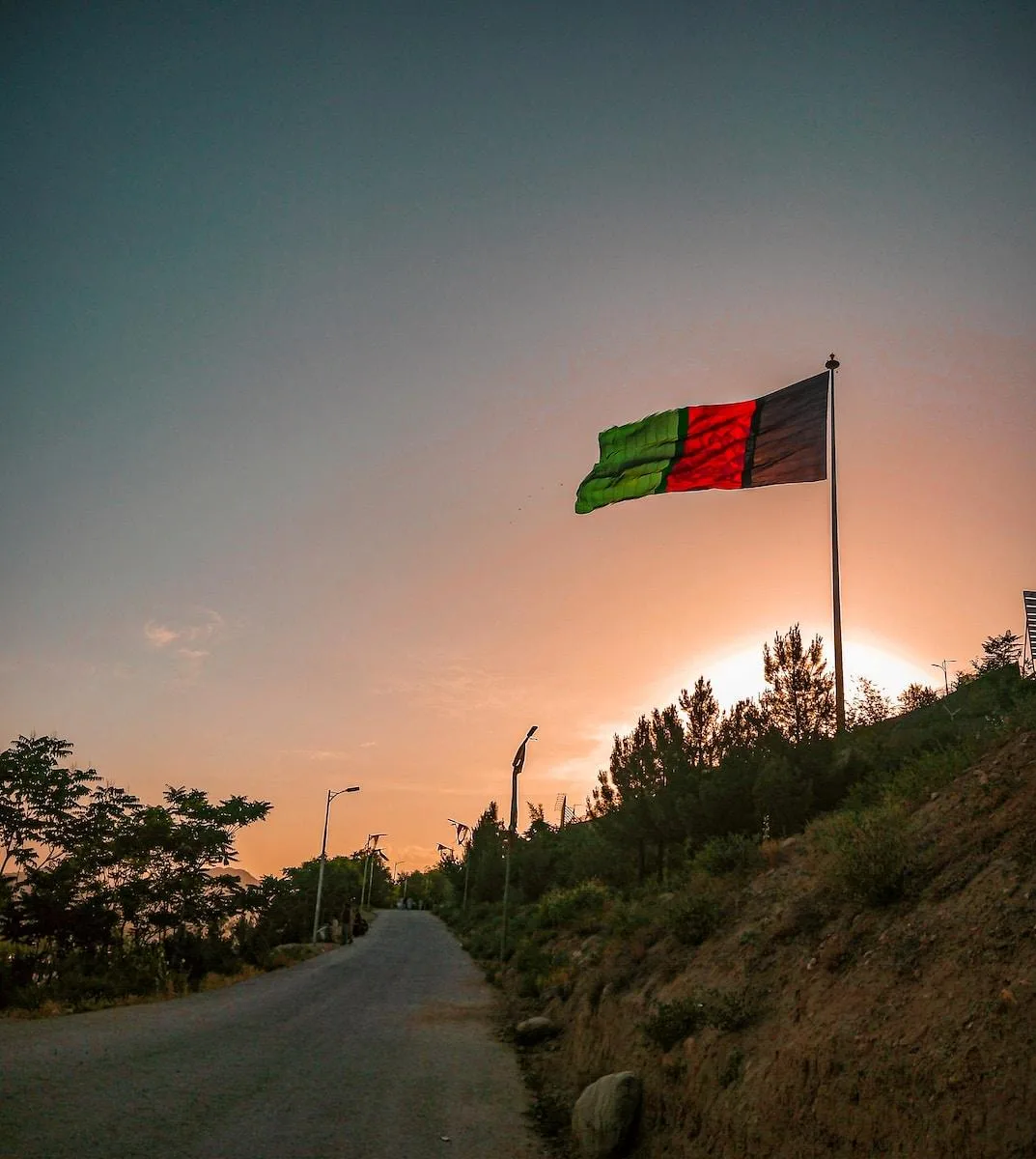 a flag is flying high in the sky