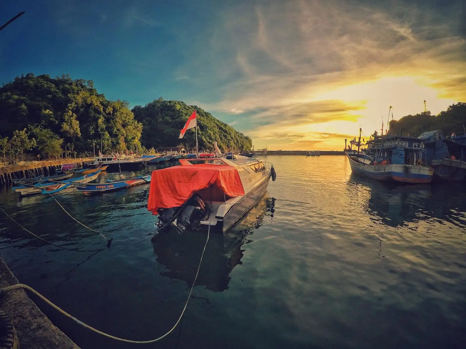 Photo by ahmad syahrir Motor Boat Near Dock during Sunset