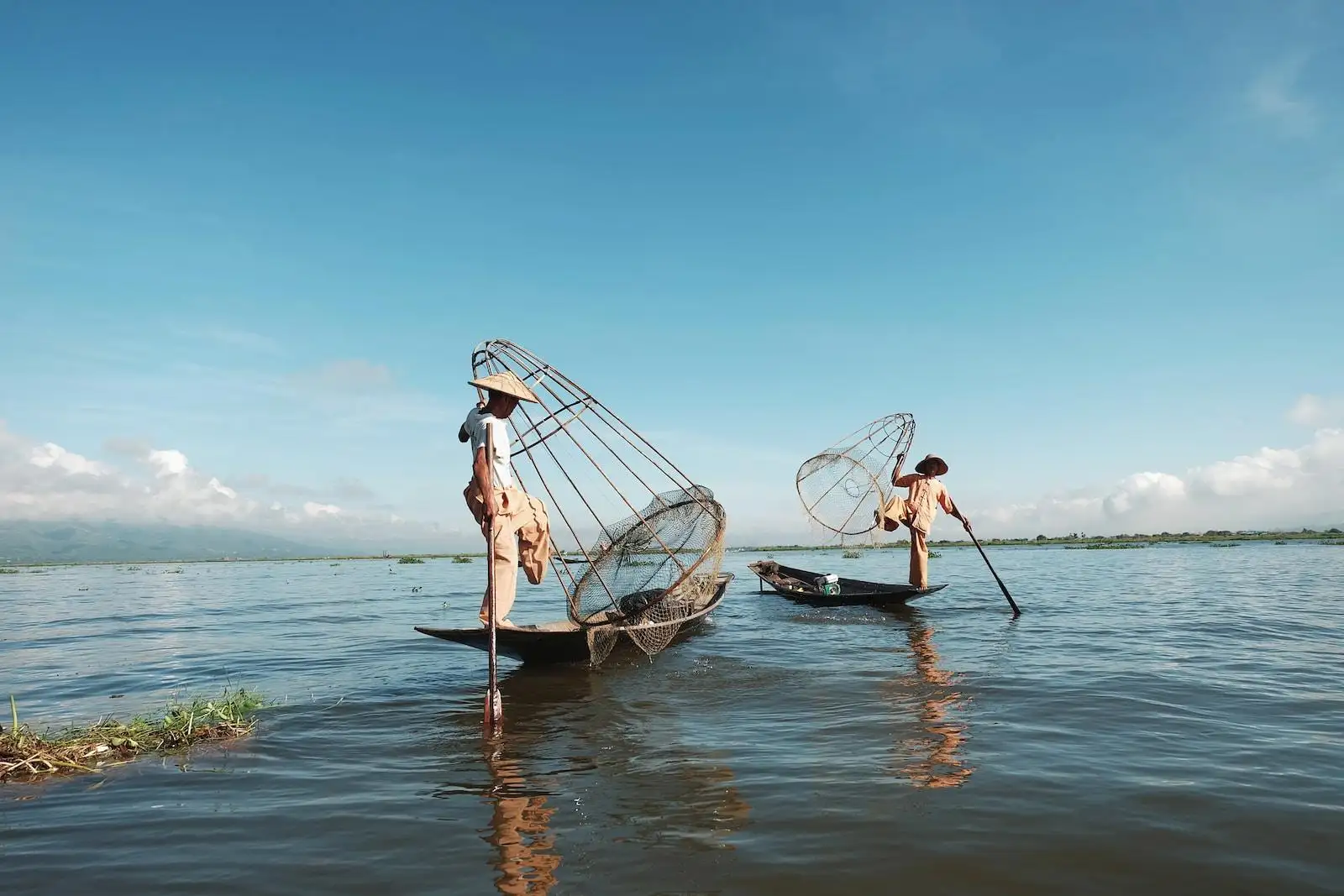 Photo by Mega Caesaria two man riding boat on body of water