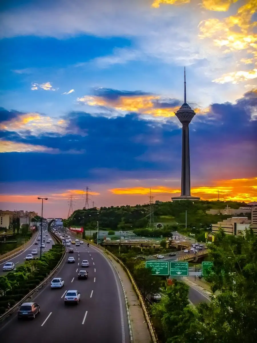 Photo by Khashayar Kouchpeydeh city with high rise buildings under blue sky during daytime