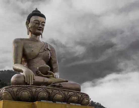 Buddha Statue Under Cloudy Sky