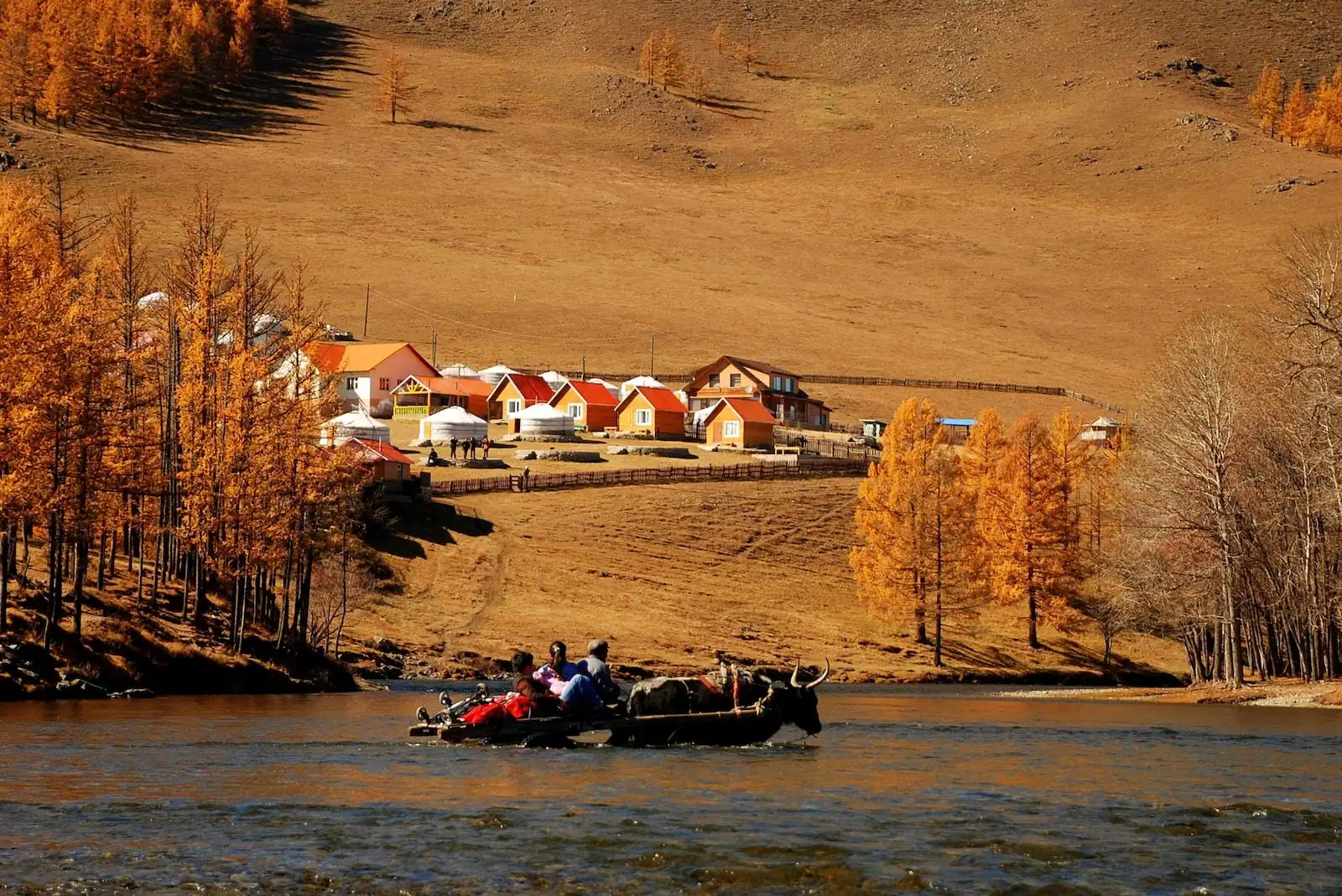 Photo by Snowscat red and white houses facing body of water