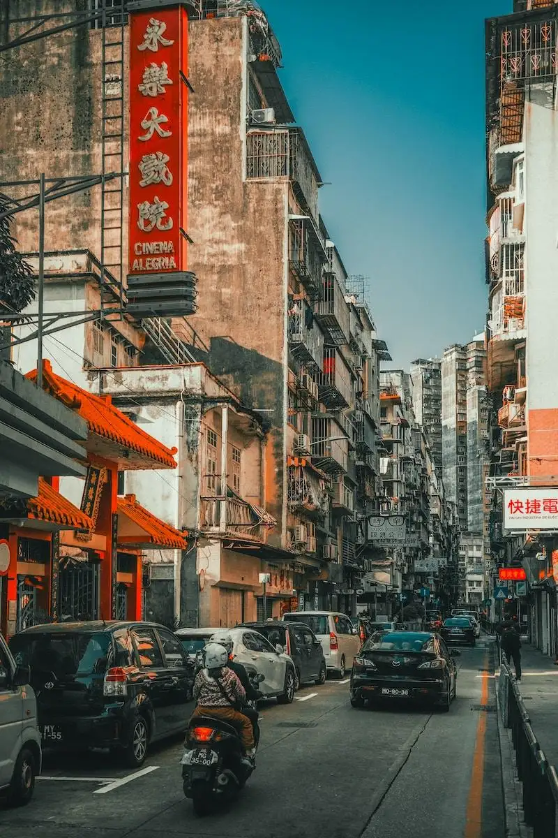 Photo by Dynamic Wang a city street filled with lots of traffic