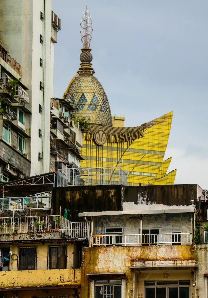 Photo by Jimmy Woo a large building with a large yellow building in the background