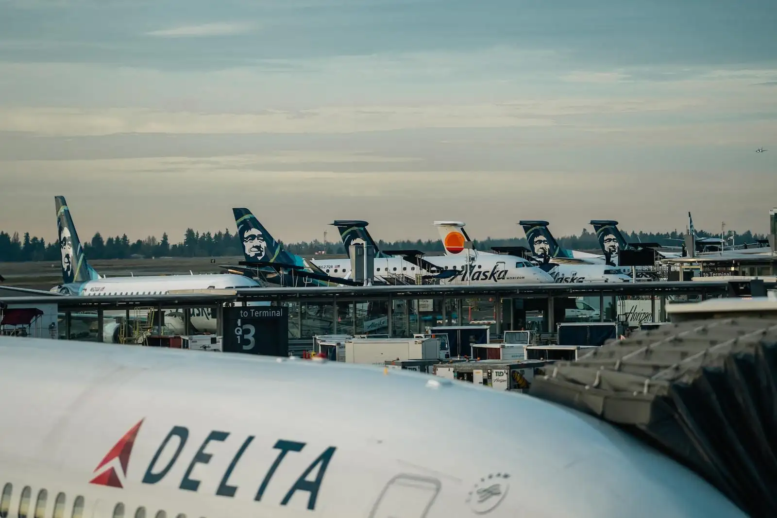 Photo by Jack Prommel a group of airplanes parked at an airport