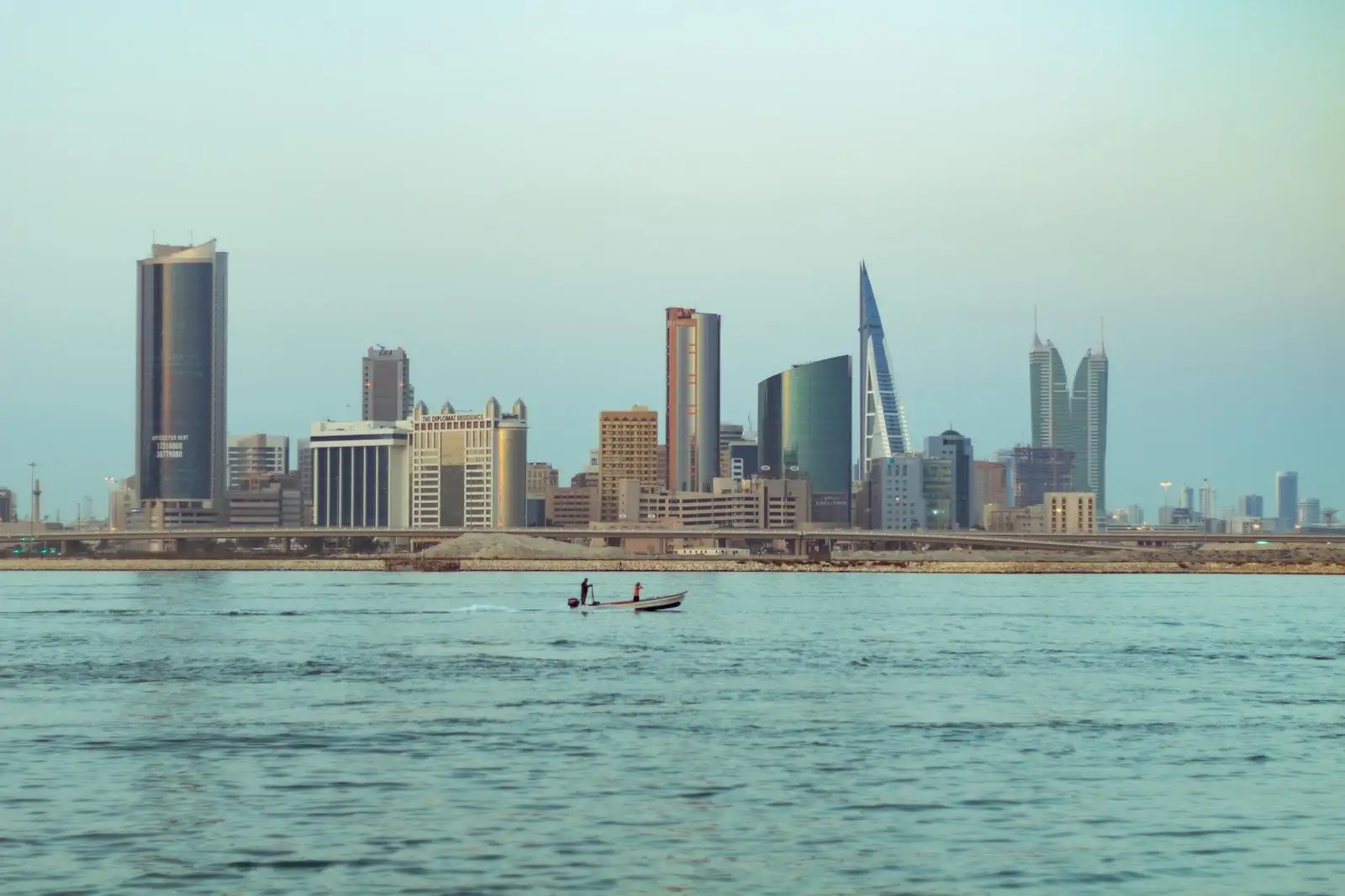 Photo by Ajmal Shams person riding on white boat on sea during daytime