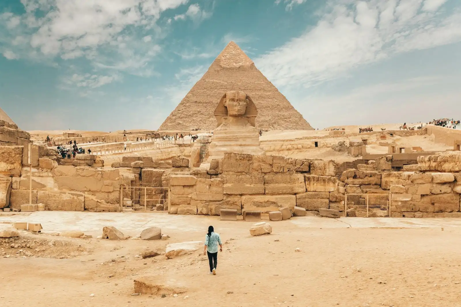 Photo by Spencer Davis person walking near The Great Sphinx