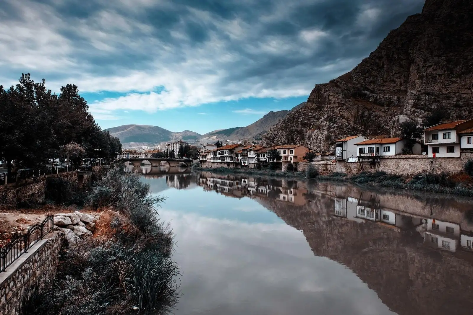 Photo by Emre body of calm water near houses and trees during daytime