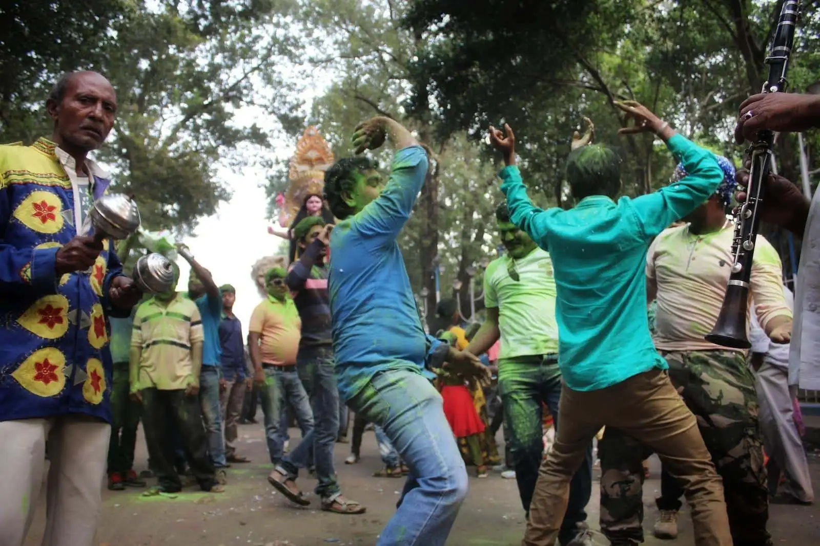 a group of people dancing in a park