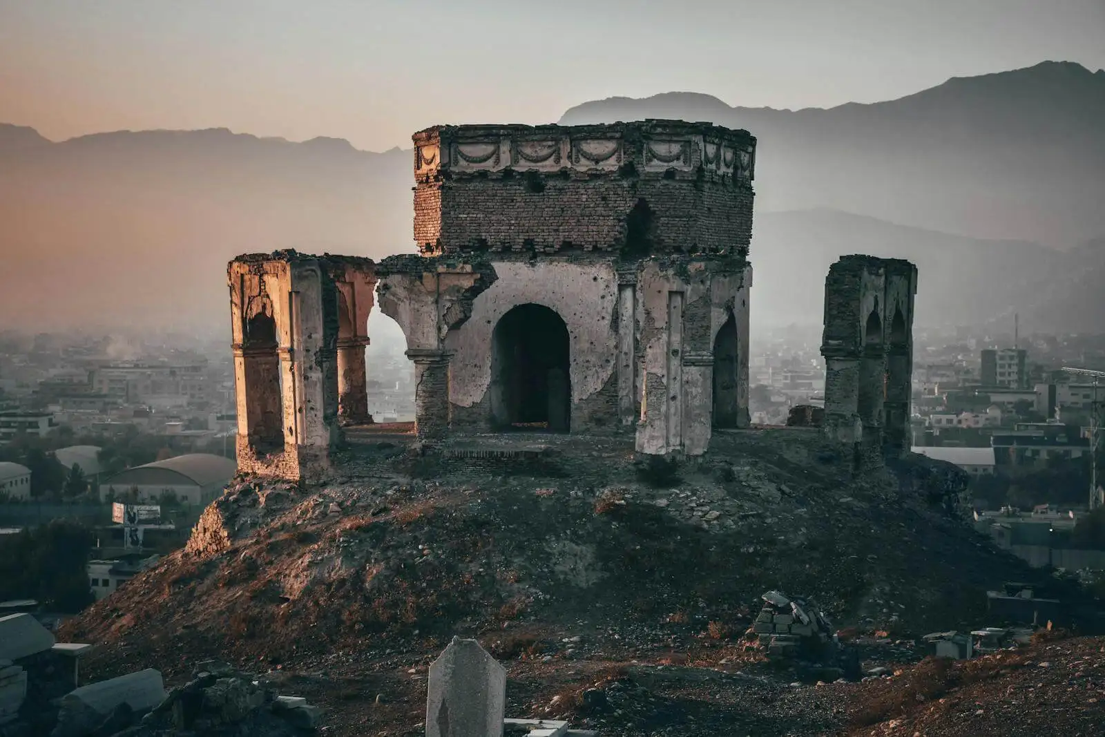 Photo by Suliman Sallehi Gray Concrete Building on Top of Hill