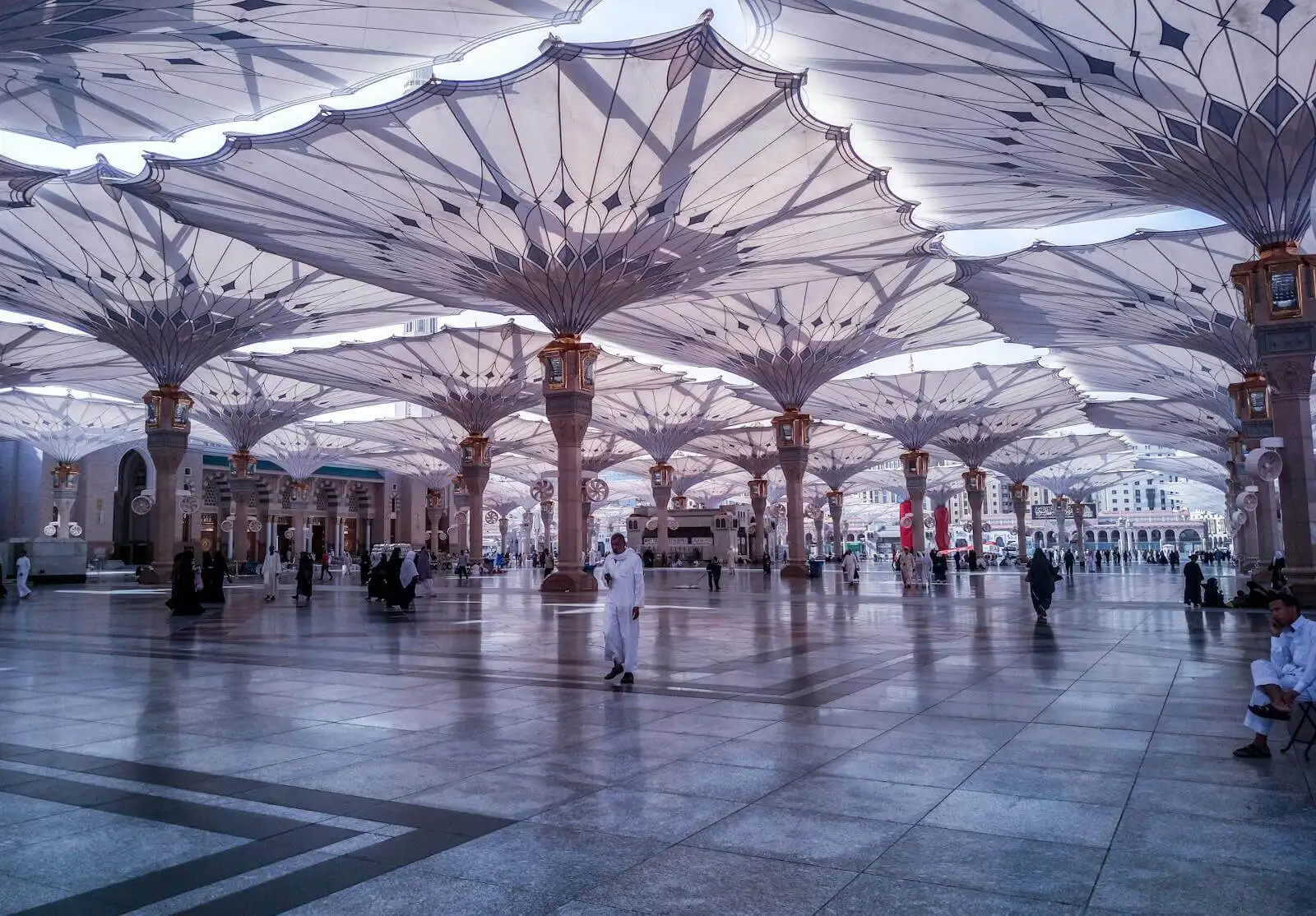 Photo by Mohammed Zayed People Walking on White and Gray Tiled Floor