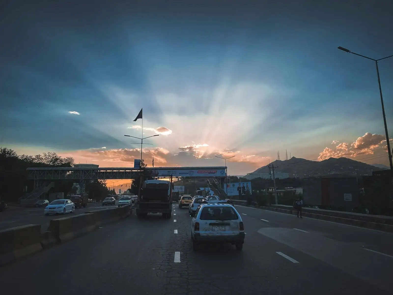 Photo by Sohaib Ghyasi white car on road during daytime