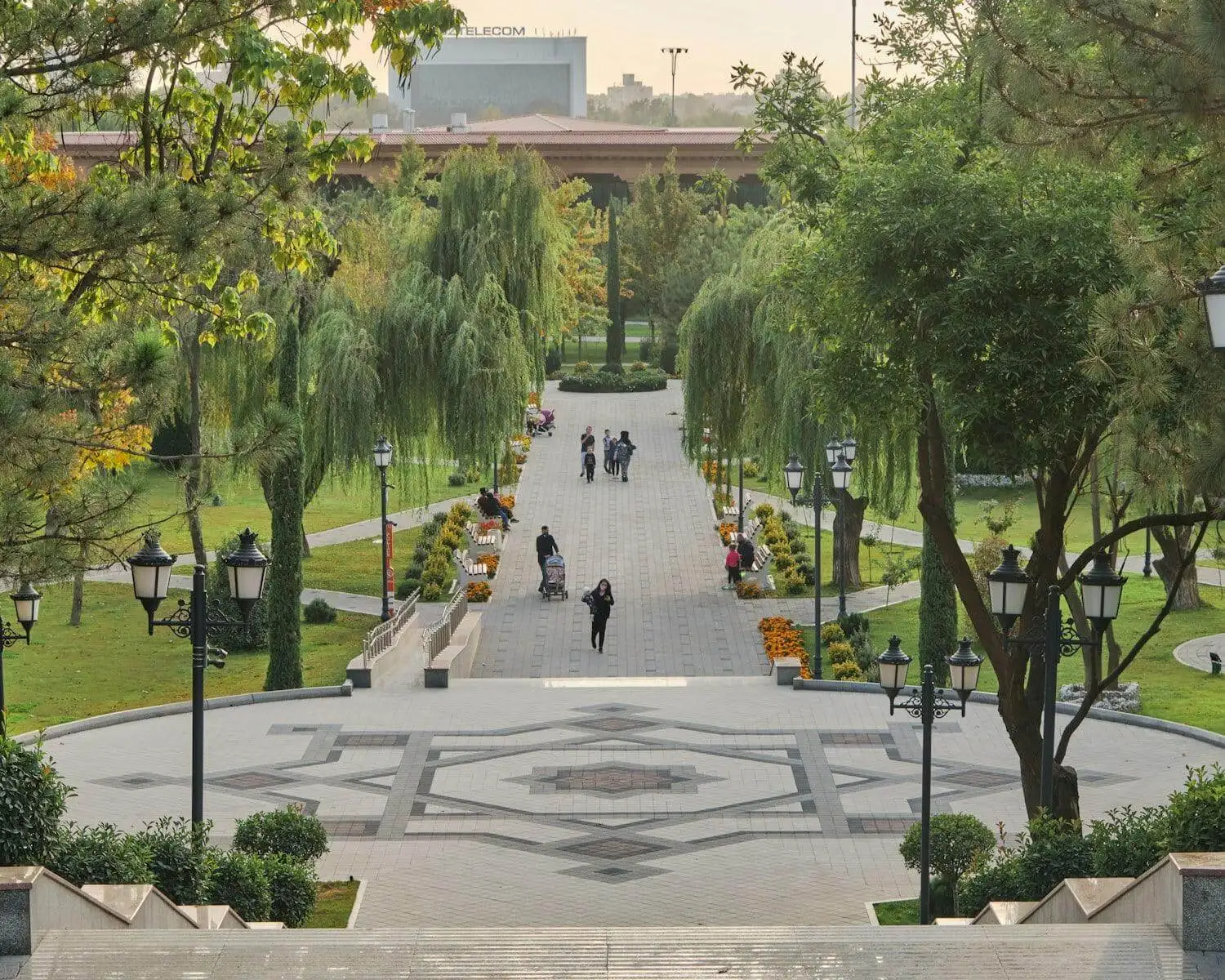 Photo by Farhodjon Chinberdiev people walking on park during daytime